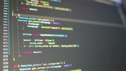 Close-up View of Colorful Source Code on LCD Screen.
