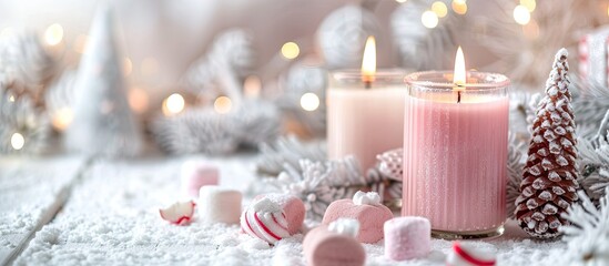 Poster - Merry Christmas decoration concept with candles and festive decor, colorful marshmallows, christmas trees on light white background. Cozy home. Space for text. Copy space image