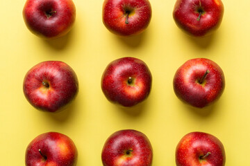 Wall Mural - Many red apples on colored background, top view. Autumn pattern with fresh apple above view