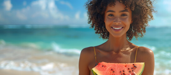 Wall Mural - beautiful young woman eating a slice of watermelon on the beach