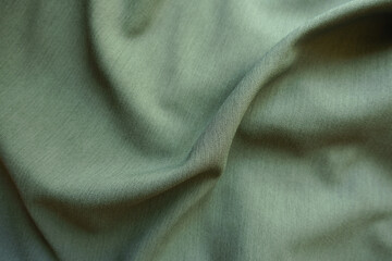 Sticker - reseda green polyester fabric with herringbone pattern in soft folds