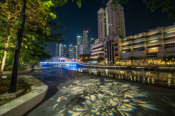 Wall Mural - Singapore - September 13, 2023: River walk and buildings at night