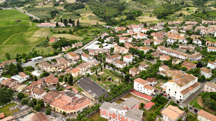 Canvas Print - Aerial view of the historic center of Casciana Terme, Pisa, olive trees and vineyards in the background