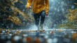 © Pinklife - An individual wearing a yellow jacket sprints along a rain-soaked forest trail, water splashing beneath their feet, embodying energy, commitment, and autumn's natural beauty.