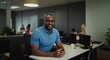 © 2April - Smiling man in a modern office setting with a friendly and professional atmosphere. Suitable for business and teamwork-related content.