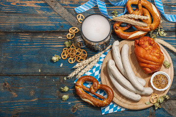 Wall Mural - Traditional Oktoberfest set. Pretzels, beer, weisswurst, eisbein with mustard. German festival food