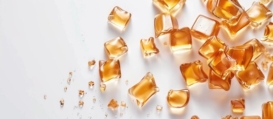 Poster - Golden butterscotch toffee candy with copy space image on white background.