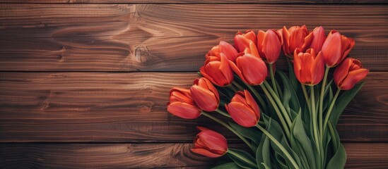 Aufkleber - Tulips arranged on a table with a wooden background, providing a lovely copy space image.