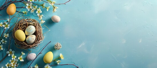 Aufkleber - Easter holiday decorations arranged on a blue background create an Easter-themed scene seen from above in this copy space image.