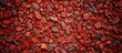 © Gular - Textured red gravel background on a wall with copy space image.