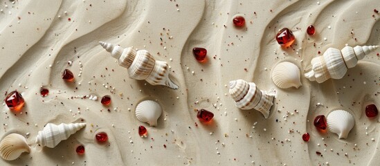Wall Mural - A summer-themed backdrop with white cone shells and red glass pebbles on a sandy surface, ideal for a copy space image.