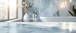 © Gular - A bare marble table background with a blurry bathroom interior for displaying products in a montage with copy space image.