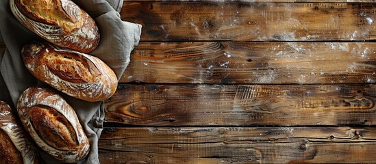 Poster - Breads freshly baked, arranged on a rustic wooden table with a blank space for an image. copy space available