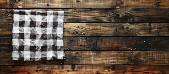 Aufkleber - An aerial view of a wooden table topped with a checkered tablecloth serves as a kitchen background, ideal for a copy space image.