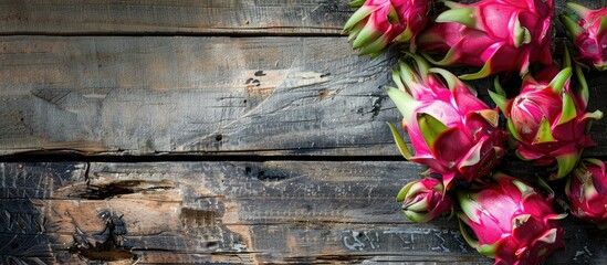 Poster - Close-up of dragon fruit on a wooden background, featuring ample copy space image.