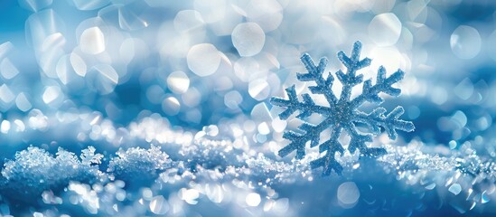 Poster - Blue snowy background with a Christmas snowflake, creating a picturesque scene with copy space image.