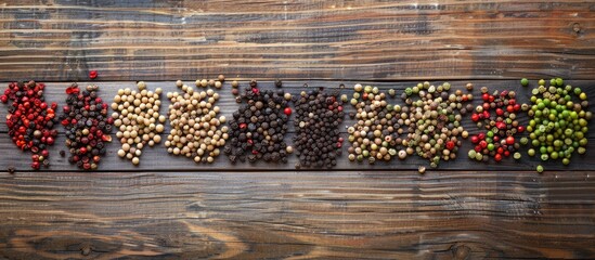 Aufkleber - Flat lay of various peppercorns on a wooden table with copy space image available.