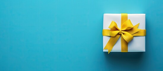 Poster - Christmas banner mockup featuring a white gift box with a yellow ribbon bow, set against a blue background, designed with a spacious copy space image for header and greeting card layouts.