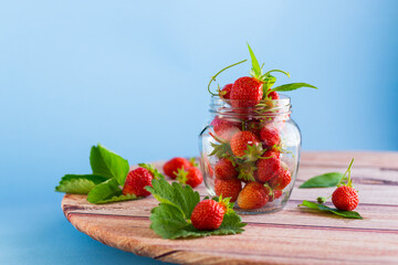 Wall Mural - fresh sweet red strawberries in a glass jar