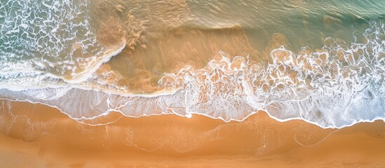Poster - Aerial view of a sandy beach with undulating patterns. Ideal summer backdrop with plenty of copy space image.