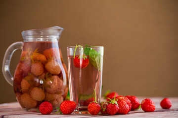 Wall Mural - Sweet refreshing berry compote of ripe strawberries in a decanter