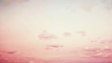 Wall Mural - Lightly pink sky at sunset. Clouds in warm colors. Summer landscape with cloudy sky. Calm background on the theme of relaxation and romance.