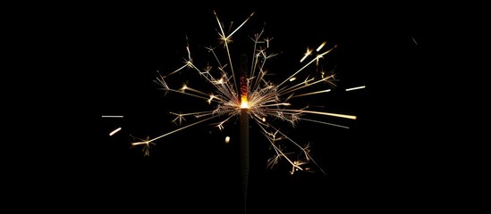 Poster - A festive Christmas sparkler displayed against a black backdrop, ideal for a copy space image.