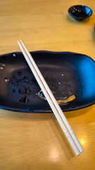 Canvas Print - Plates and chopsticks on the table