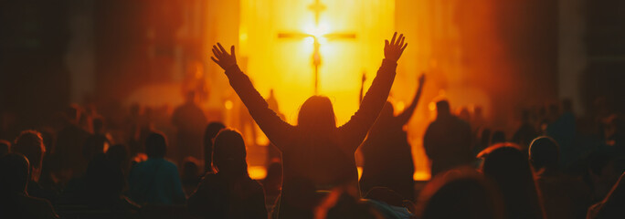 Christian worship service with raised hands in front of a cross