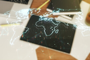 Poster - Multi exposure of abstract creative digital world map and modern digital tablet on background, top view, tourism and traveling concept