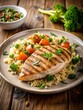 © Serjio - Grilled chicken breast with rice and steamed vegetables, including broccoli and carrots. A healthy DASH diet meal.