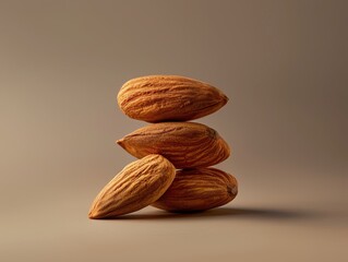 Product shoot of a stack of fresh almonds arranged on a brown surface.