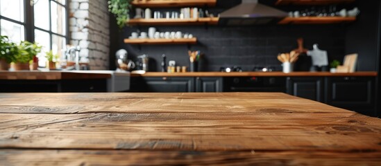 Poster - Side view on a wooden table and spacious industrial loft kitchen with vintage decor and black cabinets. with copy space image. Place for adding text or design