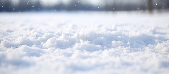 Poster - Close-up photo of white snow on the ground after snowfall with a snow-covered surface and a small depth of field, captured during winter with copy space image.