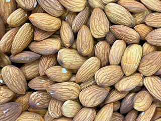 Almonds. Raw fresh organic almond nuts. Almond background. 