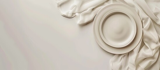 Fototapete - White table indoors with an empty plate, napkin, and copy space image available.