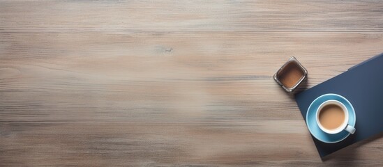 Wall Mural - Top view of office table with a cup of coffee and supplies, featuring a copy space image.