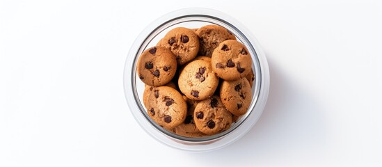 Poster - Flat lay of a turned-over jar filled with tasty chocolate chip cookies on a light gray tabletop, offering a blank space for text alongside the image. with copy space image