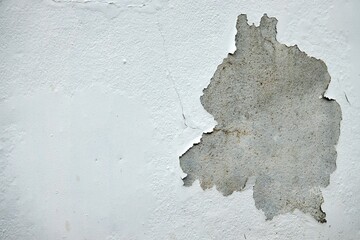 Wall Mural - A white wall with a crack in it