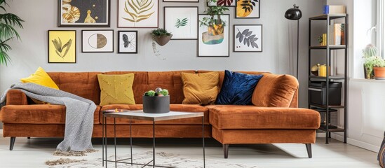 Poster - A chic living room with a brown corner sofa features a stylish collection of posters on the walls, creating a sophisticated ambiance with copy space image.