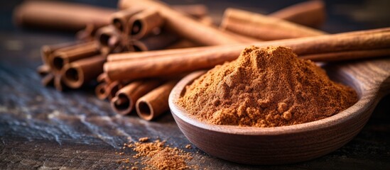 Poster - Ceylon cinnamon sticks and powder on a textured wooden surface, perfect for baking, desserts, and drinks, with a fragrant aroma. Close-up with copy space image.
