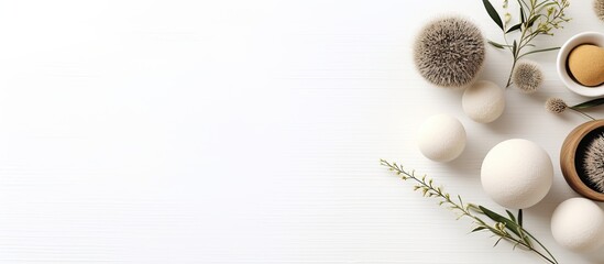 Leinwandbilder - A wellness salon setup with herbal massage balls displayed on a white background from a top view, offering ample copy space for text or design.
