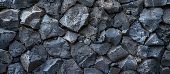 Poster - Abstract background of andesite rock wall with volcanic stone texture. Arranged rock fragments form a beautiful natural pattern. Text quotes space for copy.