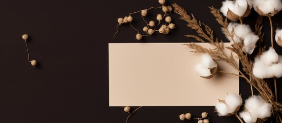 Poster - Minimalistic flat lay composition featuring blank greeting cards with dry flowers on a brown backdrop, emphasizing the mockup copy space image on the paper sheets.
