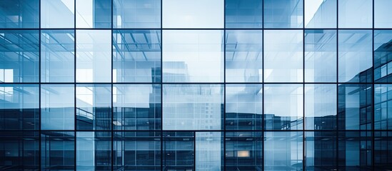 Poster - Modern building facade with glass walls, offering an abstract closeup view with reflective surfaces, providing copy space image.