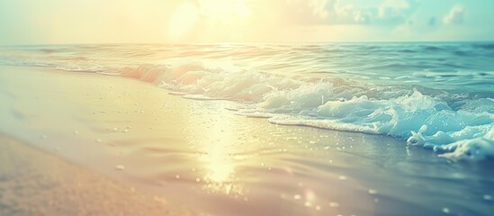 Poster - A blurry tropical beach with sunlit waves creates an abstract background for a summer vacation theme, featuring vintage tones and a relaxing atmosphere with copy space image.