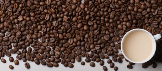 Poster - Top view of ground and whole-grain coffee on a light background with copy space image.
