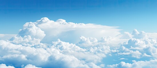 Aufkleber - The expansive blue sky filled with fluffy white clouds creates a serene copy space image.