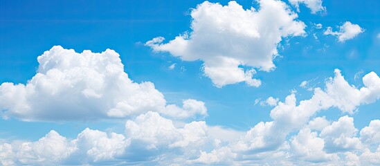 Poster - Clouds in a clear blue sky with copy space image.