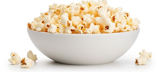Poster - Fresh salty popcorn in a white bowl, isolated on a white background, perfect for a copy space image.